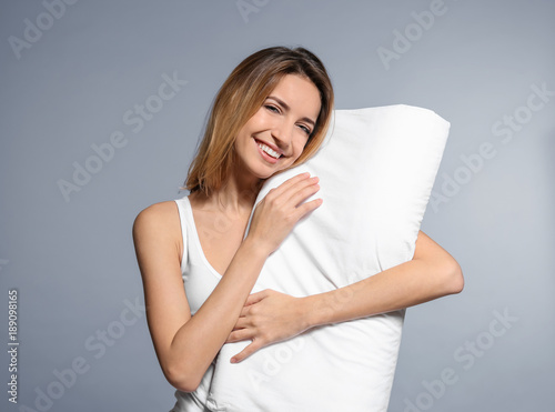 Young woman with soft pillo...