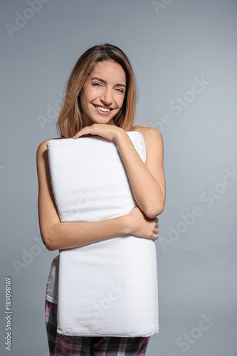 Young woman with soft pillo...