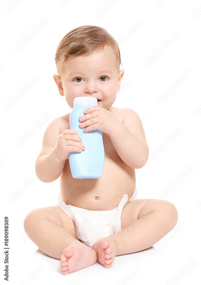 Cute baby with bottle of body cream on white background Cute baby with bottle of body cream on white background