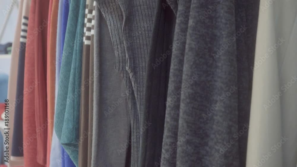 Sale of clothes in the store Clothing store. Clothes are given for sale in the store. Racks for demonstration of clothes. Movement of the camera. Sale of clothes in the store Clothing store. Clothes are given for sale in the store. Racks for demonstration of clothes. Movement of the camera.