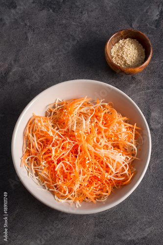 Delicious and spicy carrot spaghetti with celery root, sesame seeds and lemon