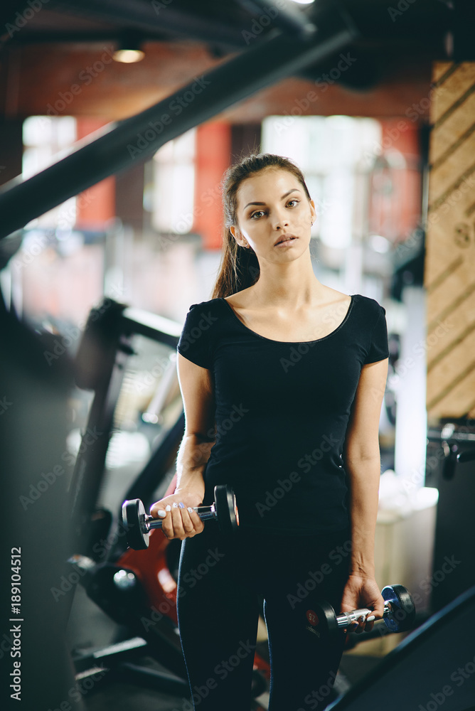 Fototapeta premium girl pumps muscles