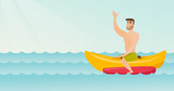Young happy caucasian white man riding a banana boat and waving hand. Cheerful man having fun on a banana boat in the sea. Man enjoying summer vacation. Vector cartoon illustration. Horizontal layout.