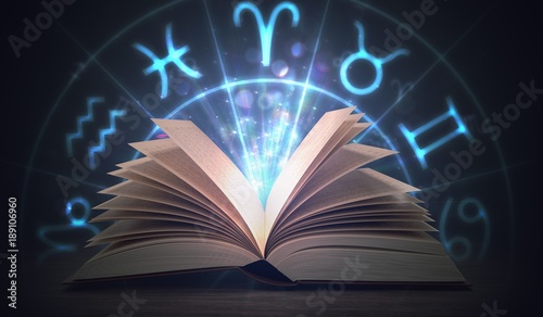 Open shining astrology book with zodiac signs above. 3D rendered illustration. photo