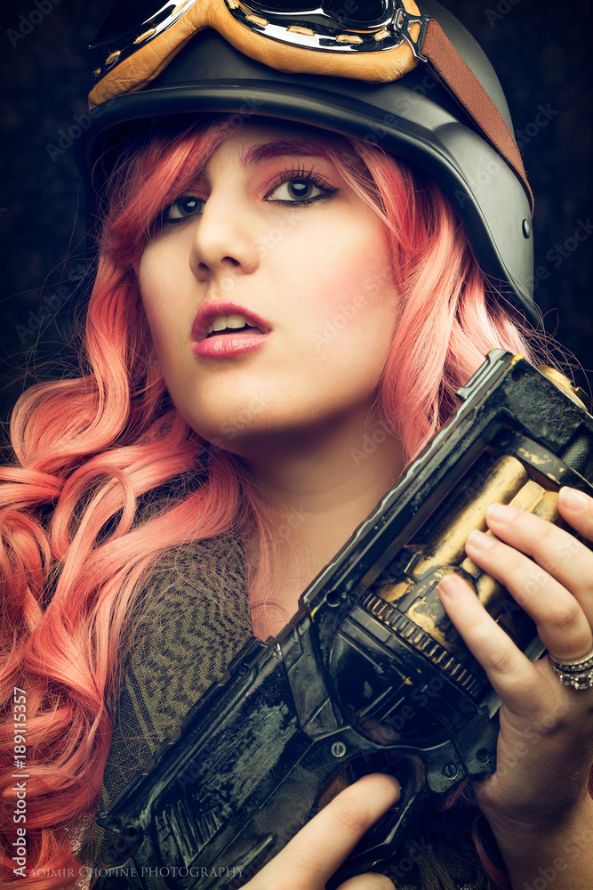Cosplay girl portrait, in helmet with pink hair Cosplay girl portrait, in helmet with pink hair