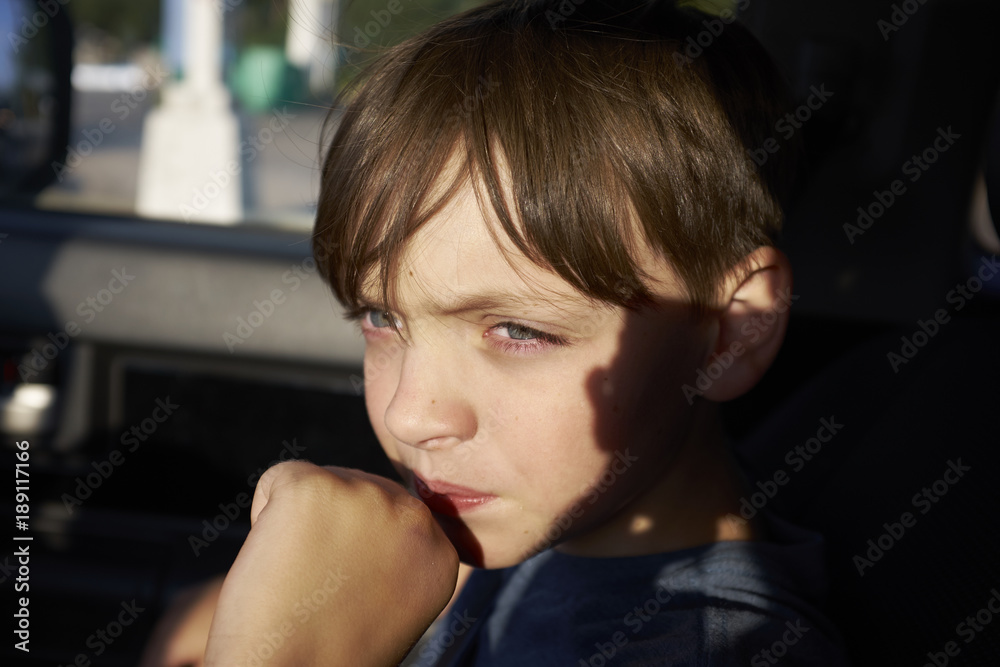 Portrait of boy in sunlight