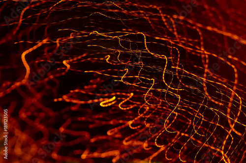 Abstract Orange Colour Light Motion Over Dark Background. Slow Shutter Speed , With Motion Blur Effect To Show Fast Movement