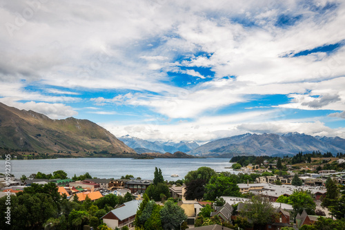 View of Wanaka lake and alpine resort town with the mountain range in the background from the Wanaka War Memorial.