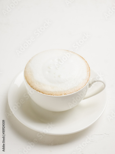 Cup of coffee on the rustic wooden background. Selective focus. Shallow depth of field.