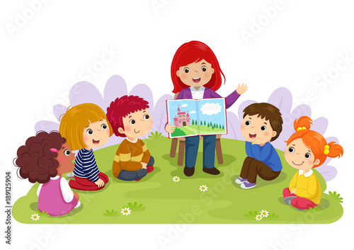Teacher telling a story to nursery children in the garden