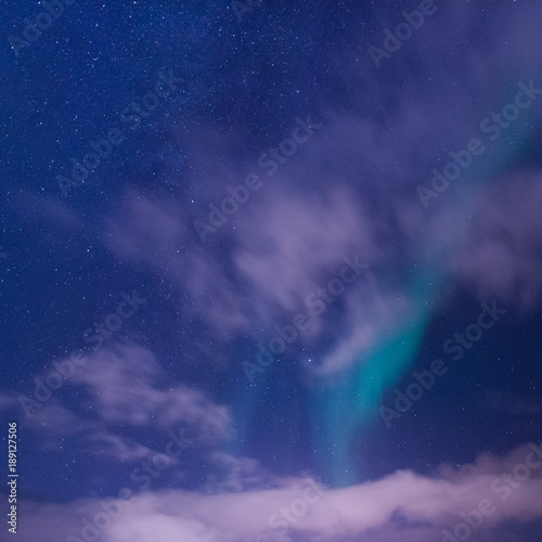 The polar arctic Northern lights aurora borealis sky star in Norway Svalbard in Longyearbyen city town mountains © bublik_polina