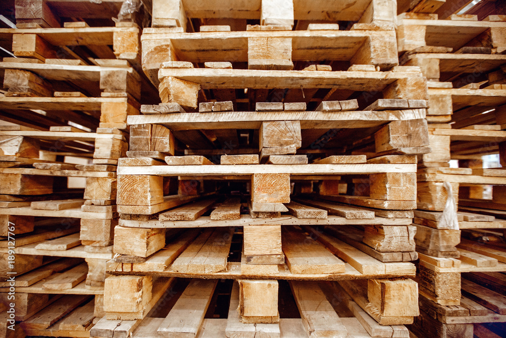 Wooden pallets stacked a warehouse