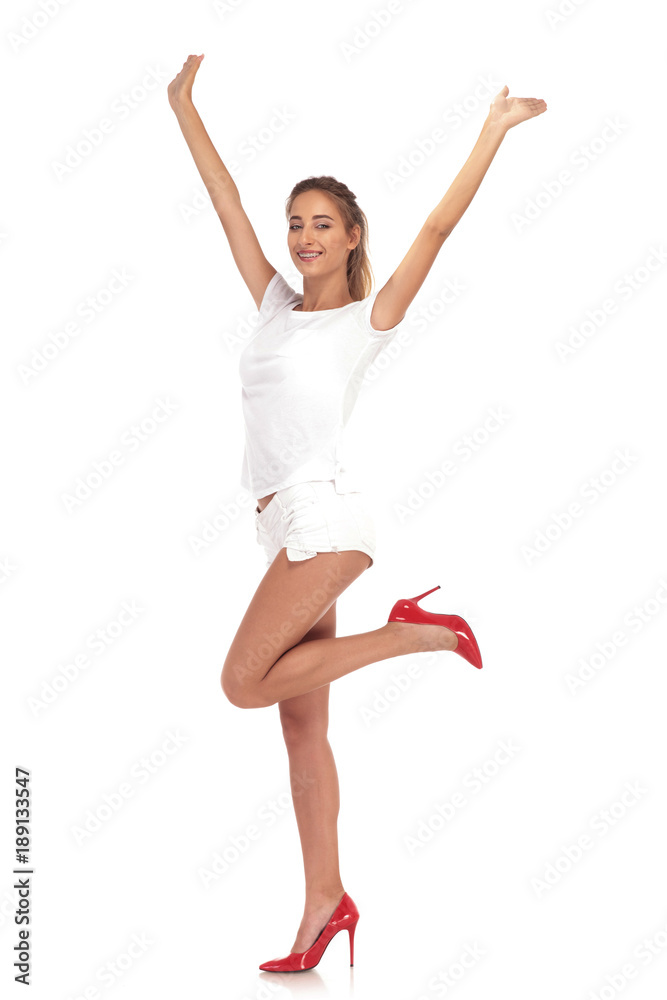woman cheering succes with hands in the air