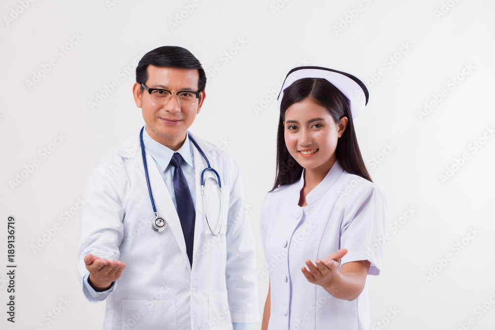 doctor and nurse medical team pointing inviting hand at you doctor and nurse medical team pointing inviting hand at you