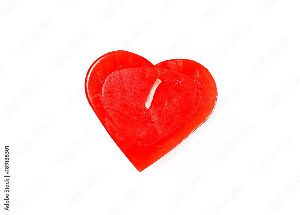 Extinguished red candle in shape of heart isolated on white background, top view