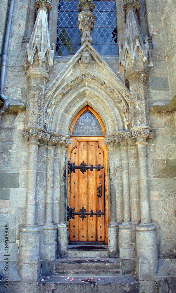 Beautiful wooden door of Stavanger cathedral, one of the oldest churches in Norway, sunny day