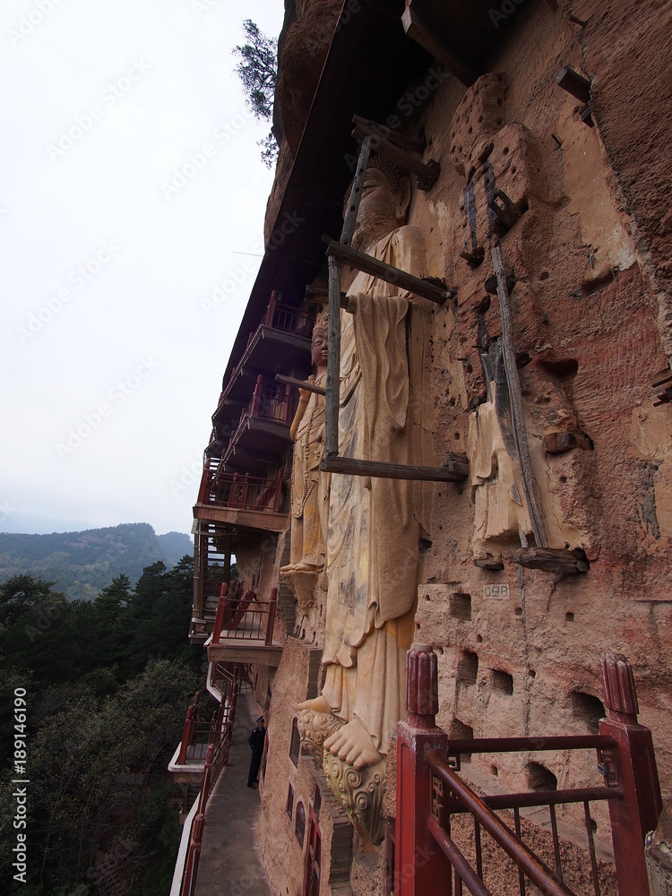 Maiji Shan Stone Mountain with ancient buddhist carving statue. Travel in Tianshui City, Gansu, China. In 2013, October 16th. Maiji Shan Stone Mountain with ancient buddhist carving statue. Travel in Tianshui City, Gansu, China. In 2013, October 16th.