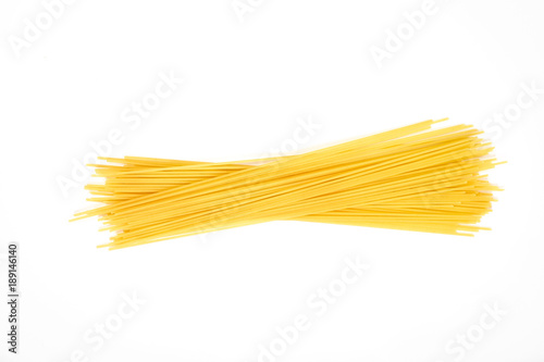 Obraz na plátně Uncooked pasta spaghetti macaroni isolated on white background