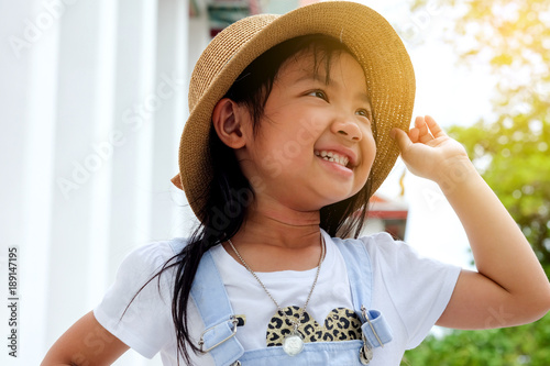 asian child girl smiling brightly or laughing with happiness