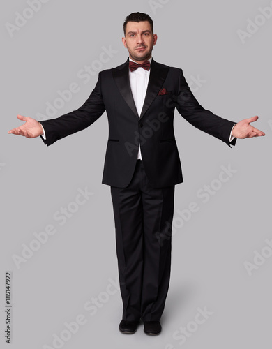 Photography fashion man in tuxedo standing