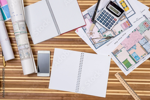 concept of architecture drawing - house, notepad, pen, ruler, compass, calculator