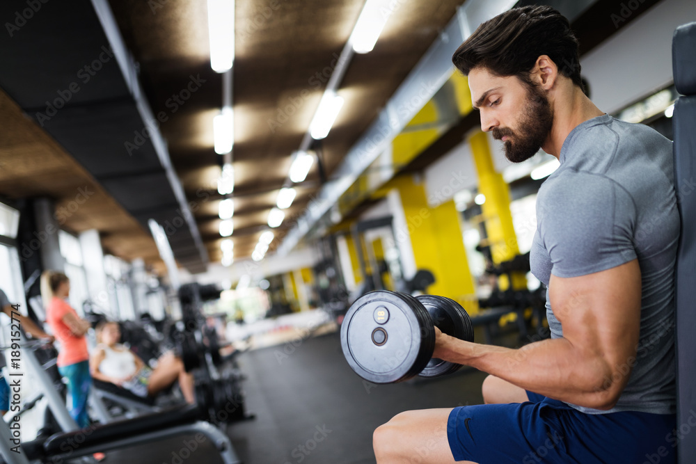 Determined male working out in gym Determined male working out in gym