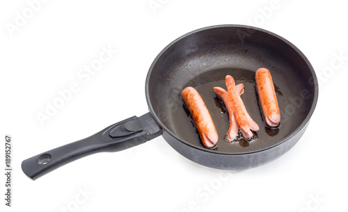 Canvas Print Vienna sausages on the frying pan during frying