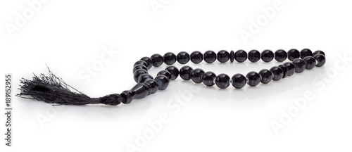 Canvas Print Black prayer beads closeup on a white background