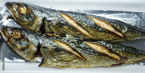 Grilled mackerel Place on foil paper with a white background.