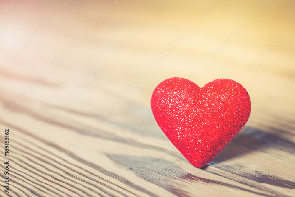 Red heart with glitter on wood Red heart with glitter on wood