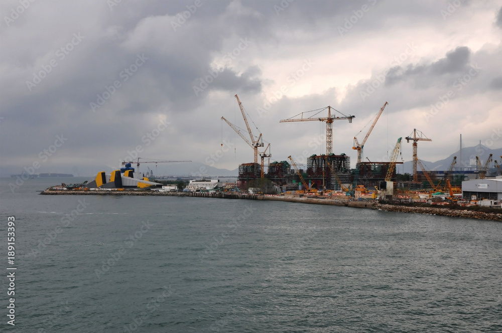 Construction Site of a new area of Hong Kong harbor with many cranes