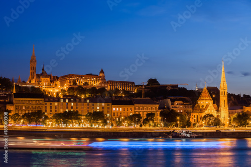 Budapest City From Danube River At Night In Hungary