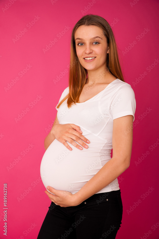 Studio photography of a beautiful pregnant woman