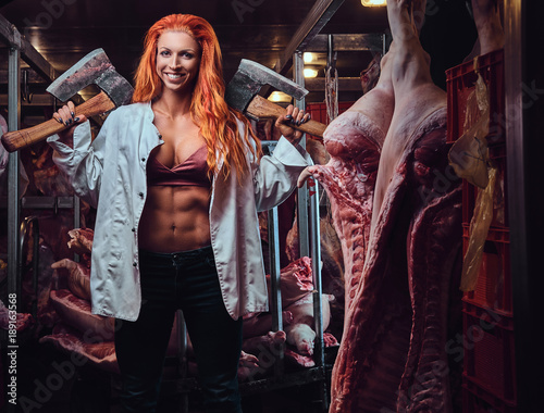 Redhead female in a meat factory.