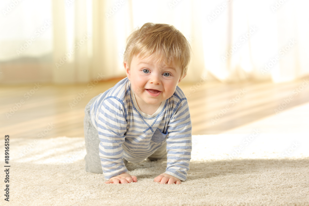 Happy baby crawling towards camera at home Happy baby crawling towards camera at home