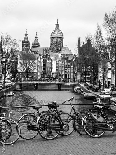 Bicycles on a bridge in Amsterdam, Netherlands. Black and white image.