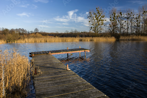 Wooden jetty and lake in autumn