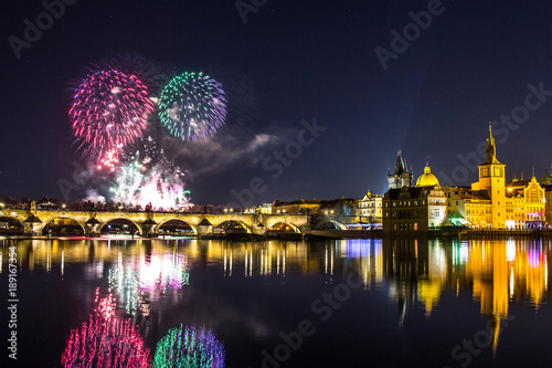 beautiful view on Colorful fireworks over Charles bridge and the river Vltava. The historical center of Prague. The Czech Republic 2018 New year.