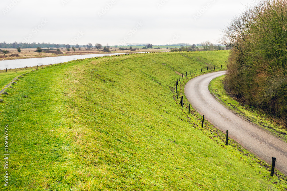 Curved dike in a Dutch landscape