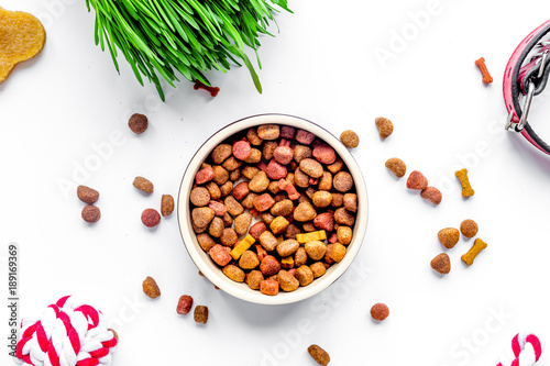 Obraz na plátně dry dog food in bowl on white background top view