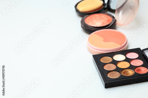Makeup products on white background