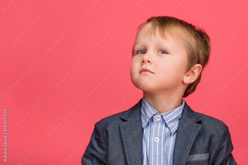 portrait of adorable little boy isolated on pink portrait of adorable little boy isolated on pink