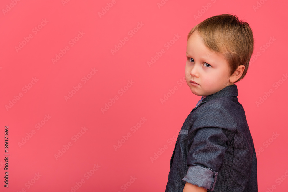 side view of adorable little boy isolated on pink side view of adorable little boy isolated on pink