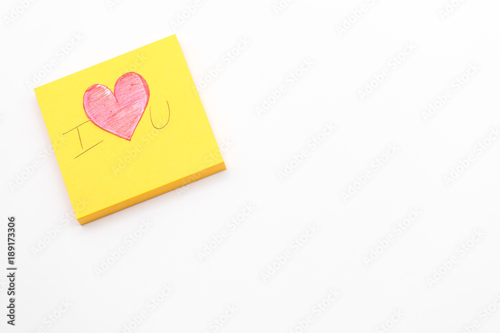 Paper red heart on Yellow Post-it note with White Pastel plastic texture background. Valentine concept. Minimal concept Paper red heart on Yellow Post-it note with White Pastel plastic texture background. Valentine concept. Minimal concept