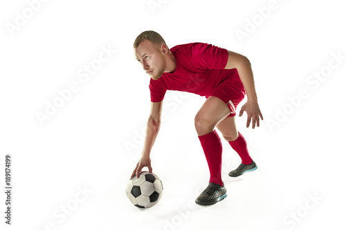 Professional football soccer player with ball isolated white background © master1305