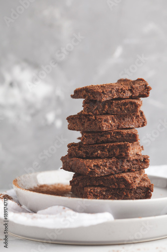 A stack of slices of healthy vegan brownies. Healthy dietary vegan dessert concept.