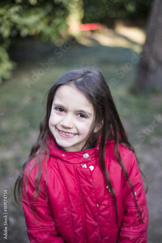portrait of a little girl of 7 years on the outside