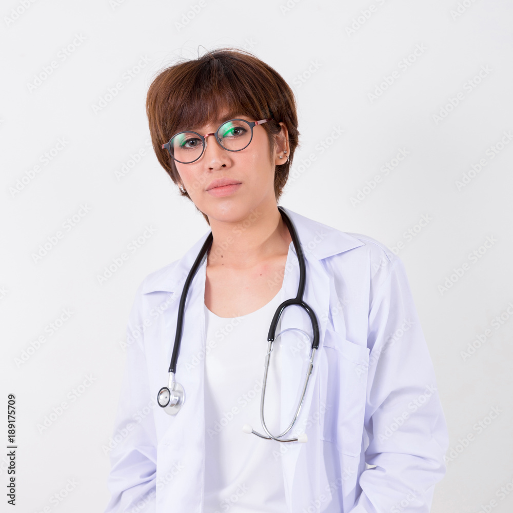 Young Asia Doctor with stethoscope. Isolated on white background. Studio lighting. Concept for healthy Young Asia Doctor with stethoscope. Isolated on white background. Studio lighting. Concept for healthy