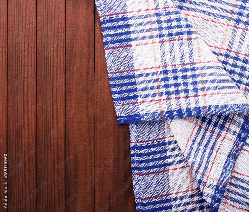 Napkin on the wooden background. Top view. Napkin on the wooden background. Top view.