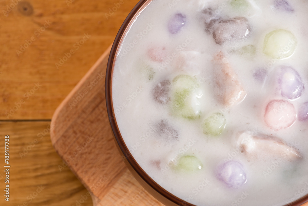 Thailand dessert, Bua Loy in cup on wooden.
Thailand dessert, Bua Loy in cup on wooden.